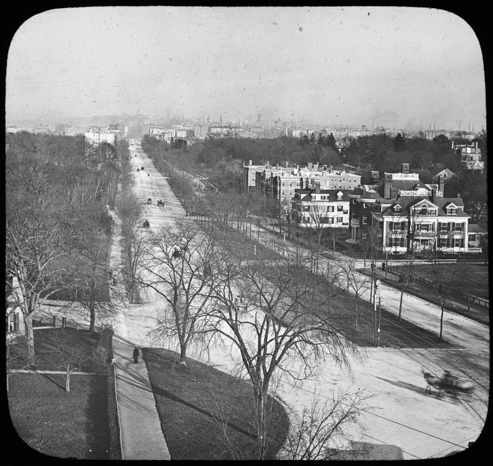 
                At Harvard St.
                        (at Coolidge Corner),
                    on north side, at outer edge,
                    elevated, view east
                    (in approx. 1900).
                (By Warren H. Manning /
                    courtesy of Iowa State University Library, Ames, IA.)
                